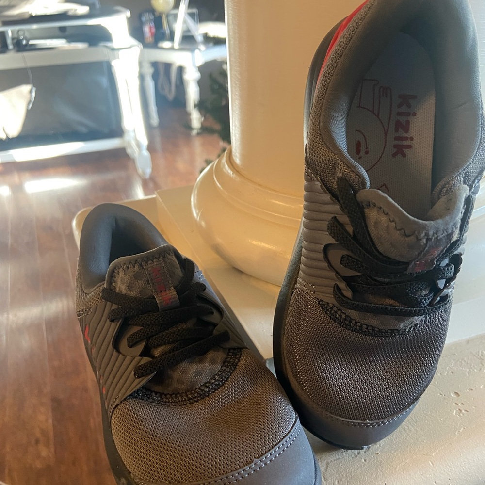 Like new. Kids boy sneakers grey and red and black.